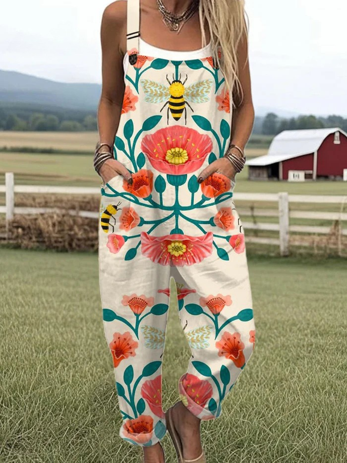 OLIVIA – SOLNEDGANG BLOMST VIDDE JUMPSUIT